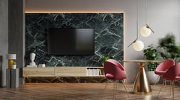 Sala de tv y comedor con paredes de mármol representación 3d